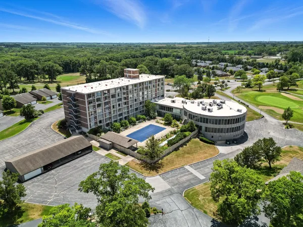 an aerial view of a house with a garden