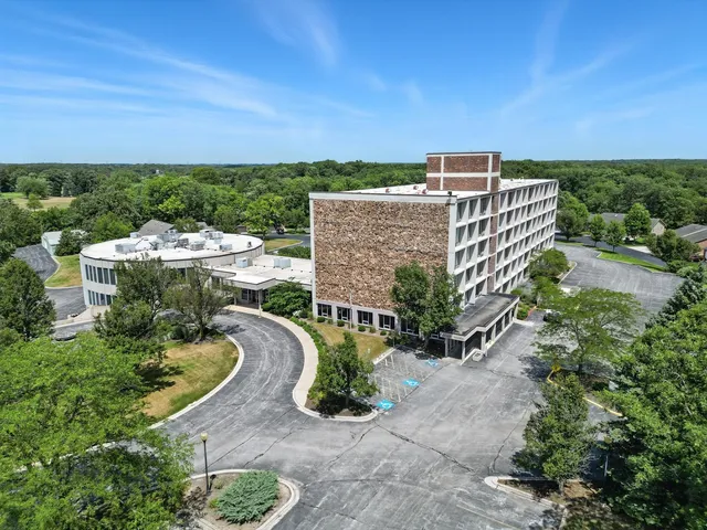 an aerial view of a house with a garden
