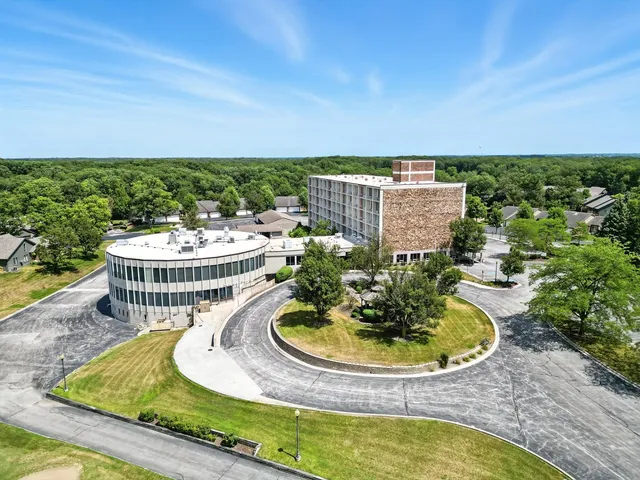 a view of a swimming pool with a patio and a garden