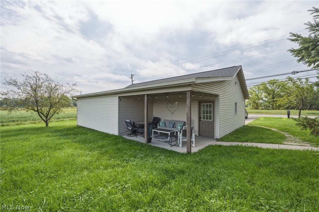 42764 Russia Road Elyria, OH 44035 - Photo 42 of 50 Attached covered patio with concrete flooring, framed by wood posts