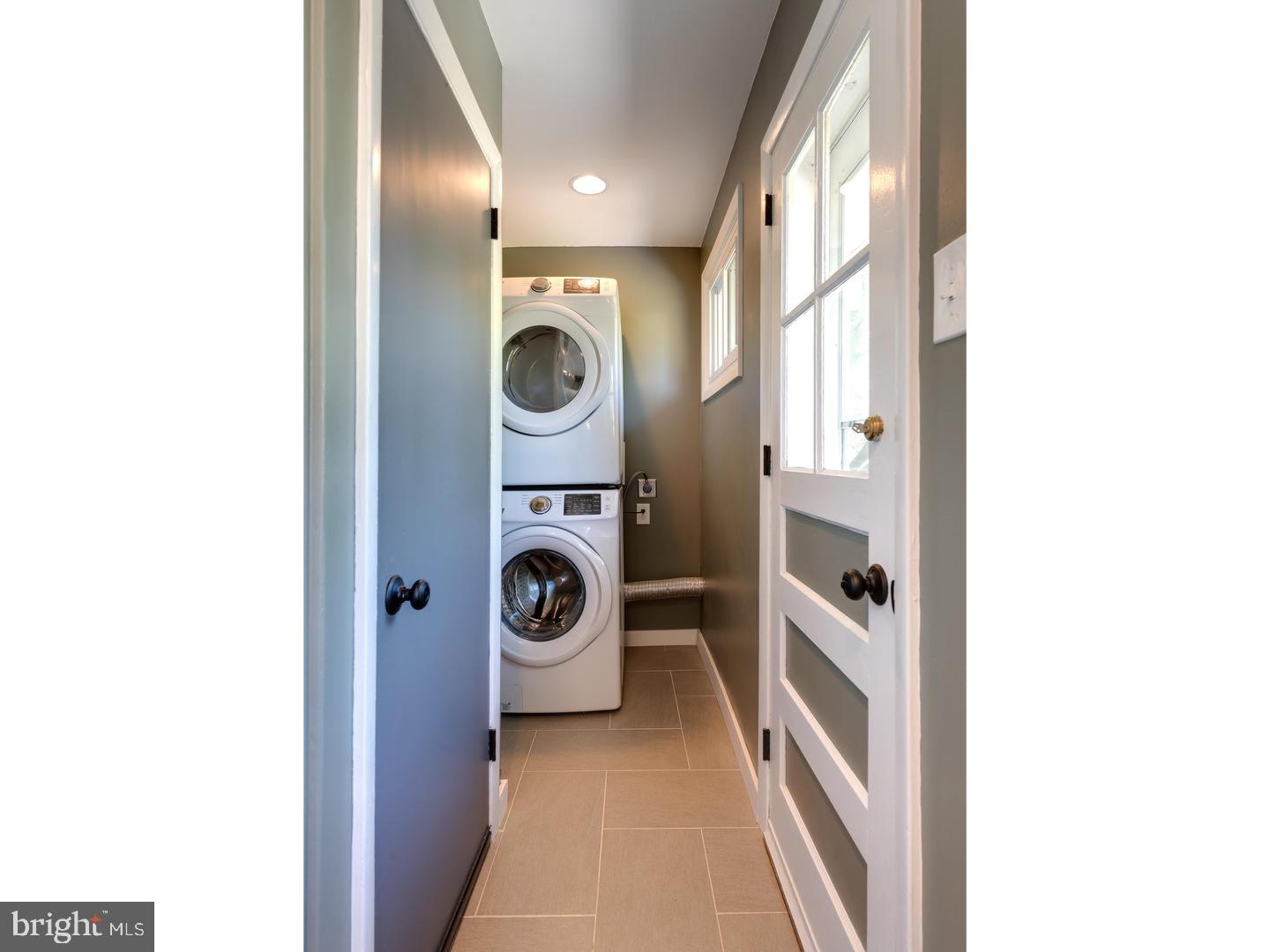 150 South Cedar Hollow Road Paoli, PA 19301 - Photo 13 of 23 a view of a hallway with washer and dryer