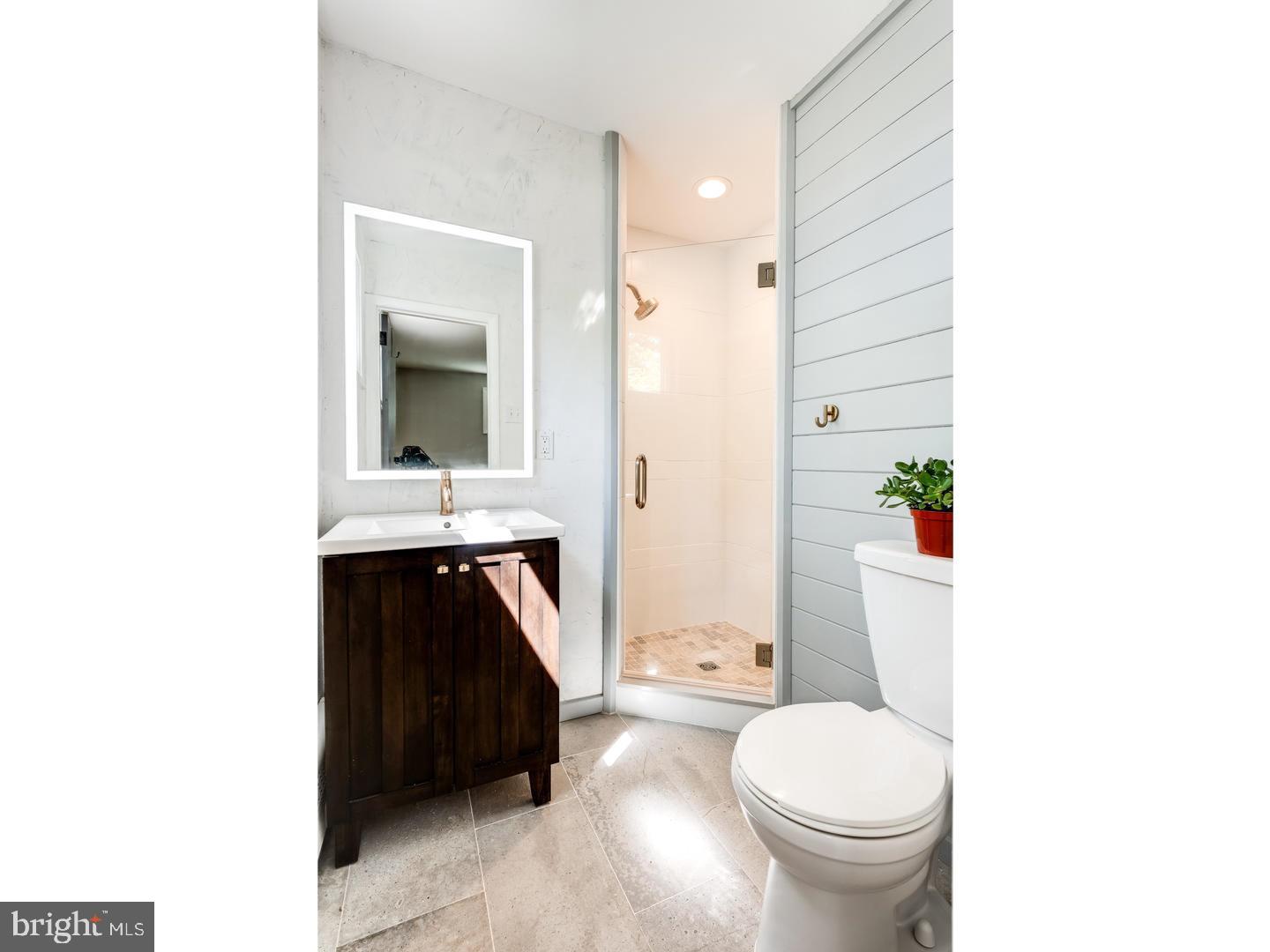 150 South Cedar Hollow Road Paoli, PA 19301 - Photo 14 of 23 a bathroom with a sink a toilet and shower