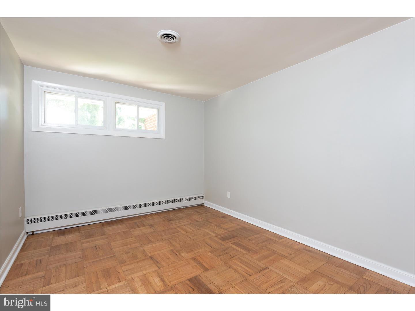 150 South Cedar Hollow Road Paoli, PA 19301 - Photo 16 of 23 an empty room with wooden floor and windows