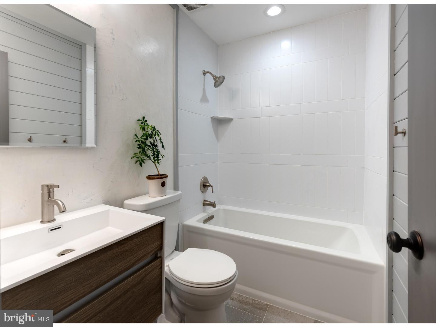 150 South Cedar Hollow Road Paoli, PA 19301 - Photo 18 of 23 a bathroom with a sink a toilet and shower