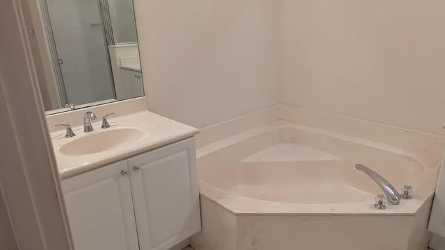 a bathroom with a sink and a bathtub