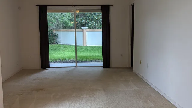 a view of a room with a large window