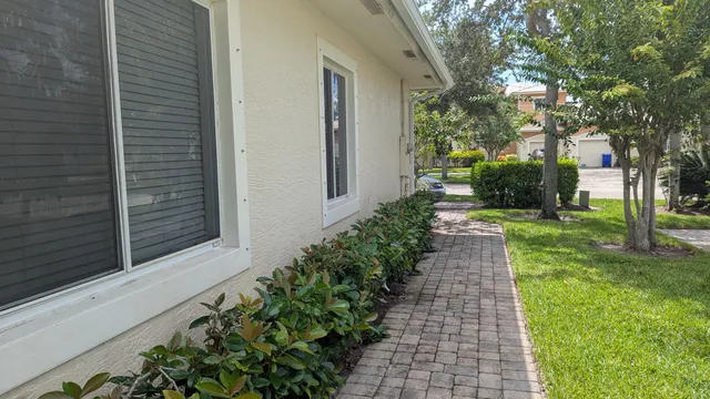 a view of a pathway with a house in the background