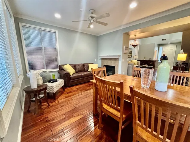 a living room with furniture a fireplace and a table