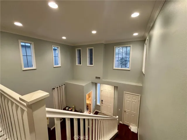 a view of a hallway with windows