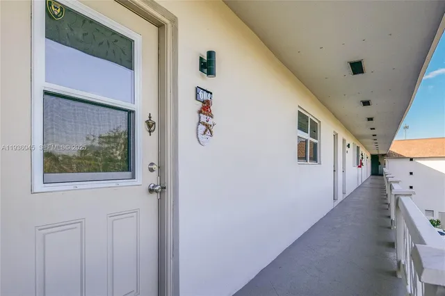 a view of a hallway to a bedroom