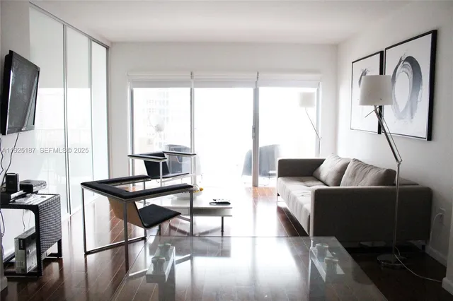 a living room with furniture and a window