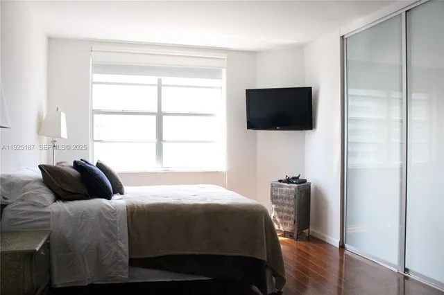 a bathroom with a toilet and a shower curtain