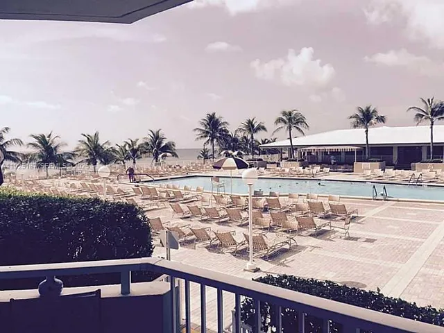 a view of swimming pool with a lake view