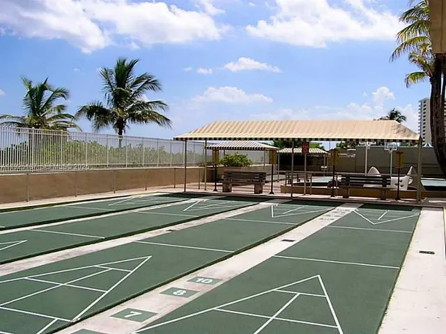 a view of a chair and table in the balcony