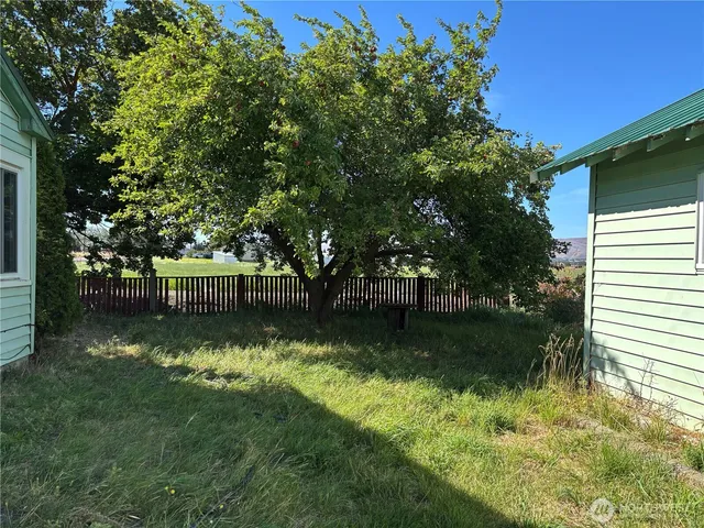 a backyard of a house with lots of green space