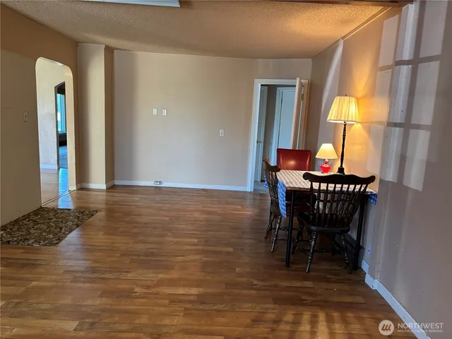 a view of a dining room with furniture and a window