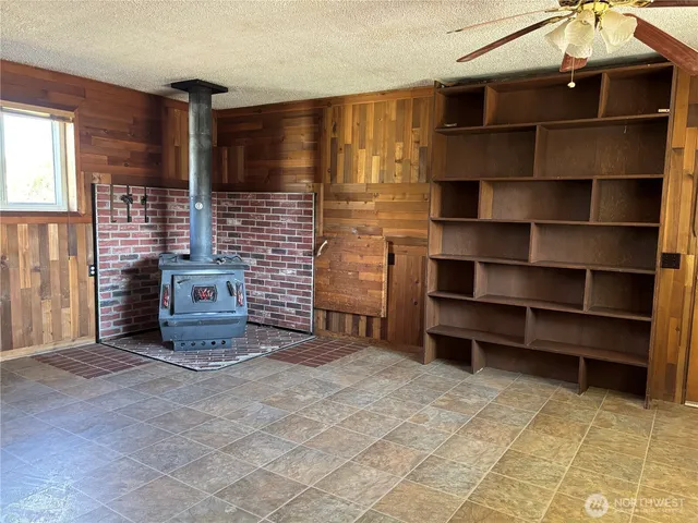 a view of an empty room with storage