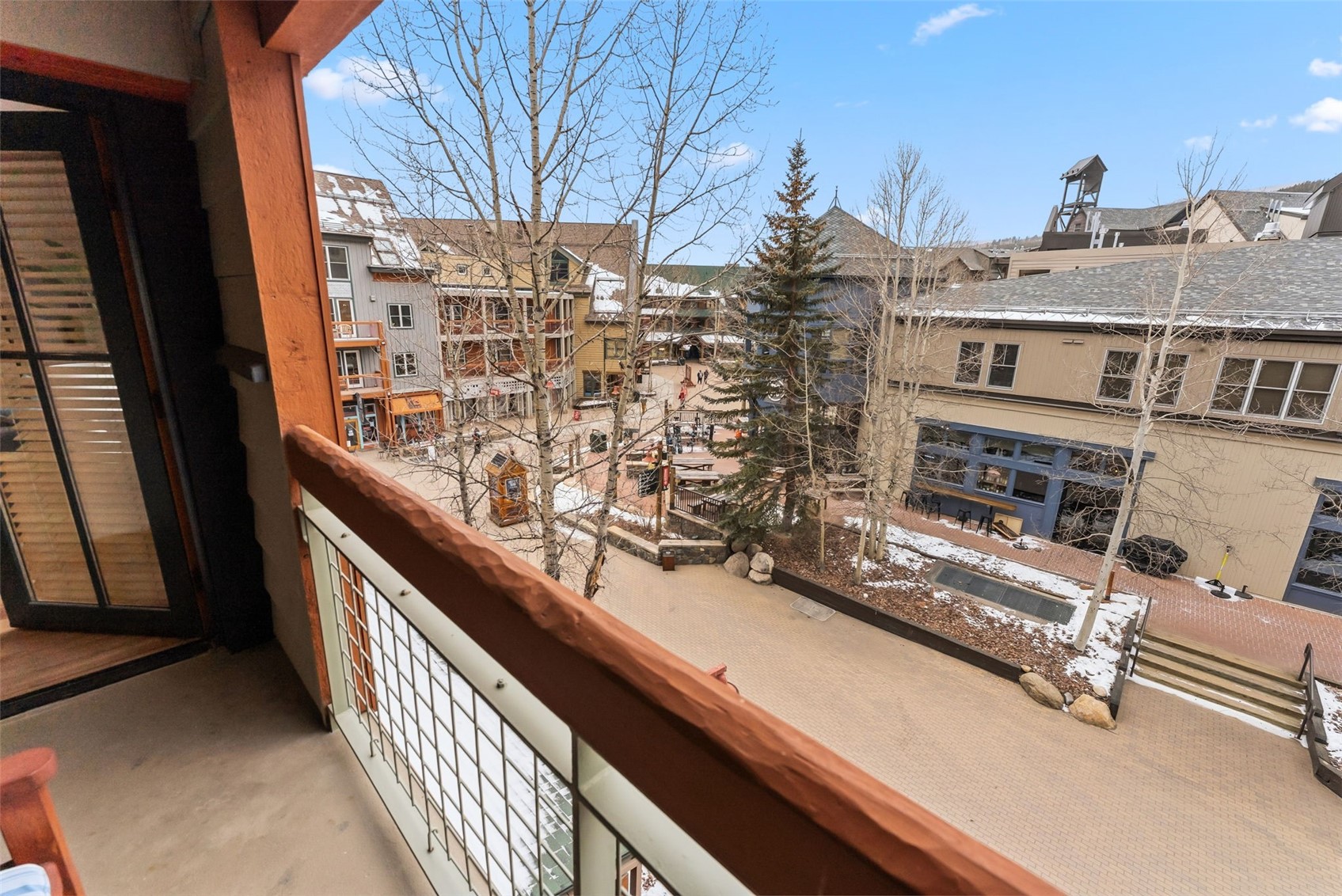 195 River Run Road, Unit 8015 Keystone, CO 80435 - Photo 23 of 35 a view of balcony with a couple of cars parked on road in front of house