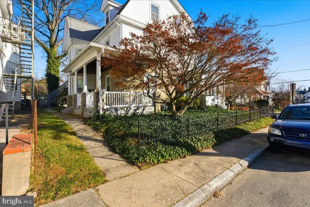a view of a house with backyard sitting area and garden
