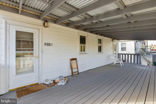a view of a porch with wooden floor