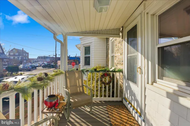 a view of a balcony with furniture