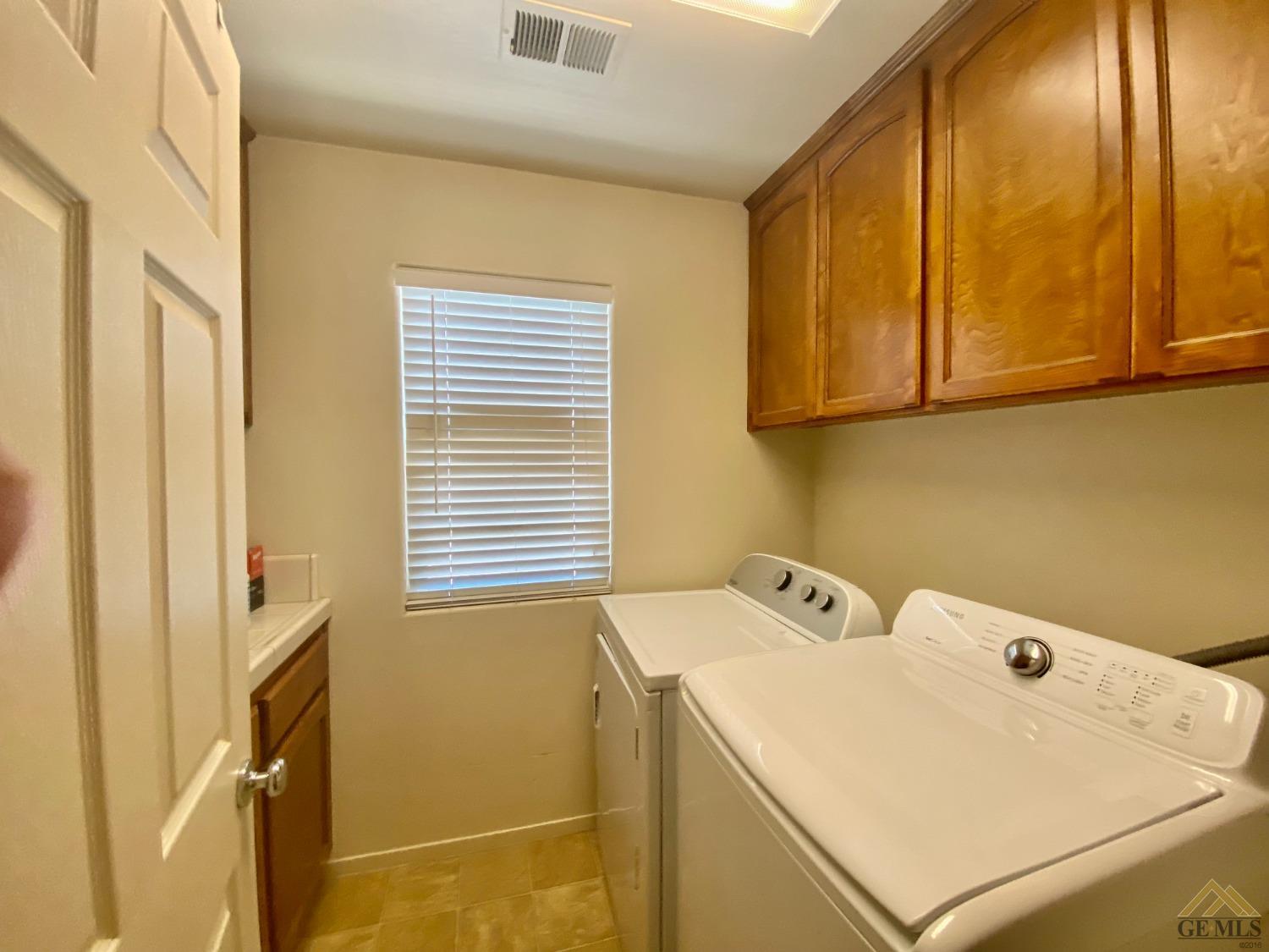 Undisclosed Address Bakersfield, CA 93312 - Photo 16 of 38 a utility room with dryer and washer