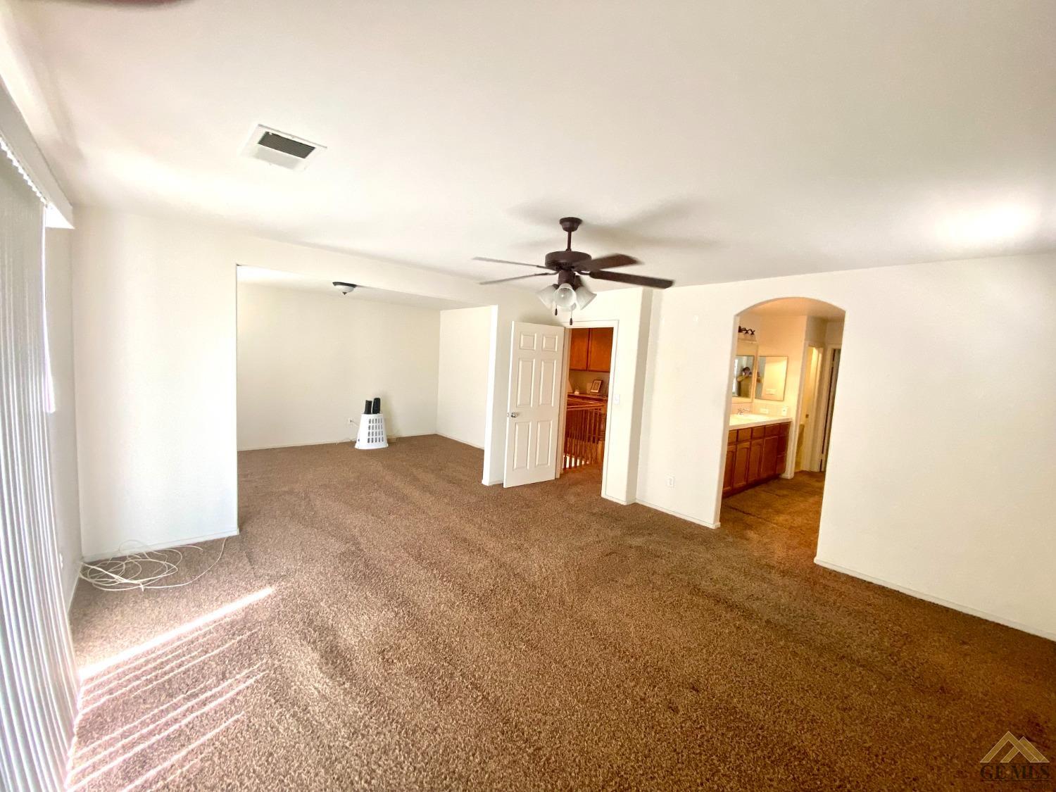 Undisclosed Address Bakersfield, CA 93312 - Photo 21 of 38 a view of a room with wooden floor