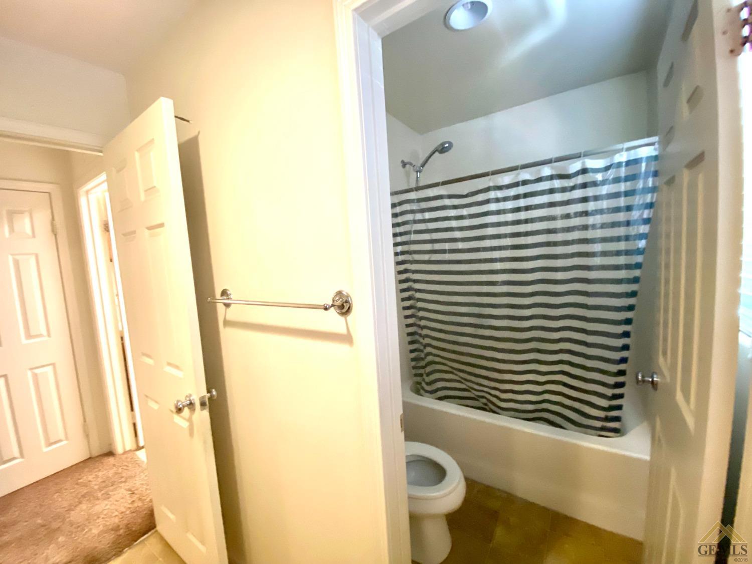 Undisclosed Address Bakersfield, CA 93312 - Photo 27 of 38 a bathroom with a sink and a mirror