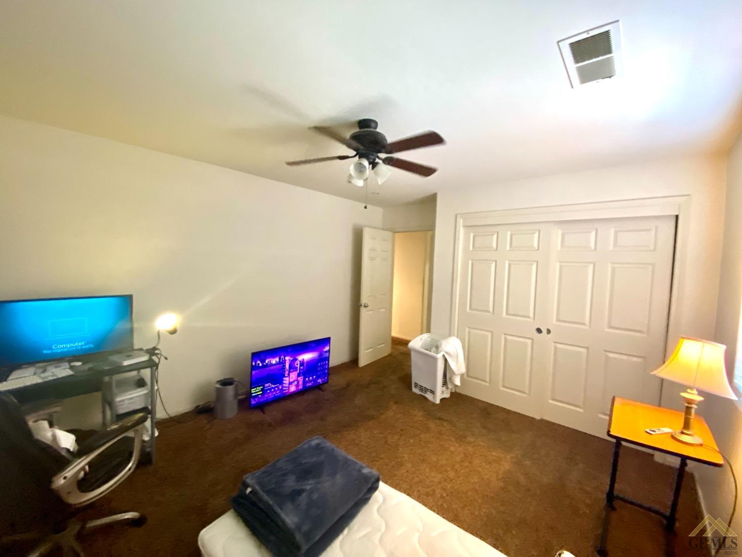 Undisclosed Address Bakersfield, CA 93312 - Photo 28 of 38 a bedroom with furniture and a window