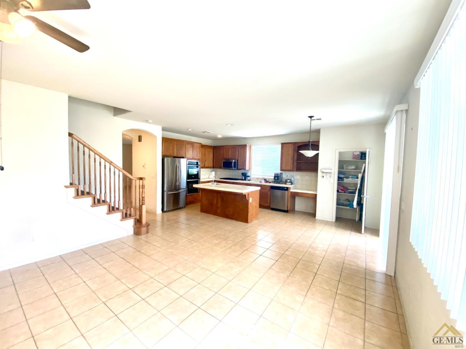 Undisclosed Address Bakersfield, CA 93312 - Photo 3 of 38 a view of a kitchen with a sink