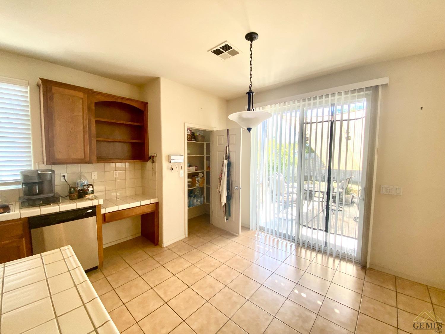 Undisclosed Address Bakersfield, CA 93312 - Photo 8 of 38 a kitchen with stainless steel appliances granite countertop a refrigerator and a sink