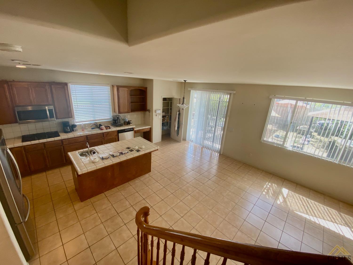 Undisclosed Address Bakersfield, CA 93312 - Photo 9 of 38 a living room with furniture and a table