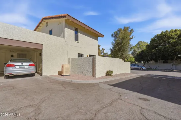 a view of a car park in front of house