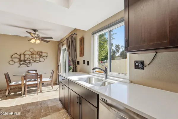 a kitchen with a sink and a window