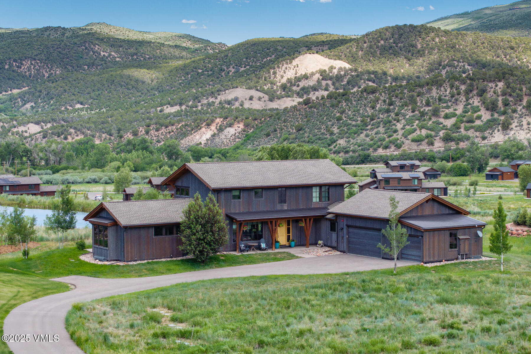 140 Hunters View Lane Eagle, CO 81631 - Photo 1 of 38 an aerial view of a house with a garden and a yard