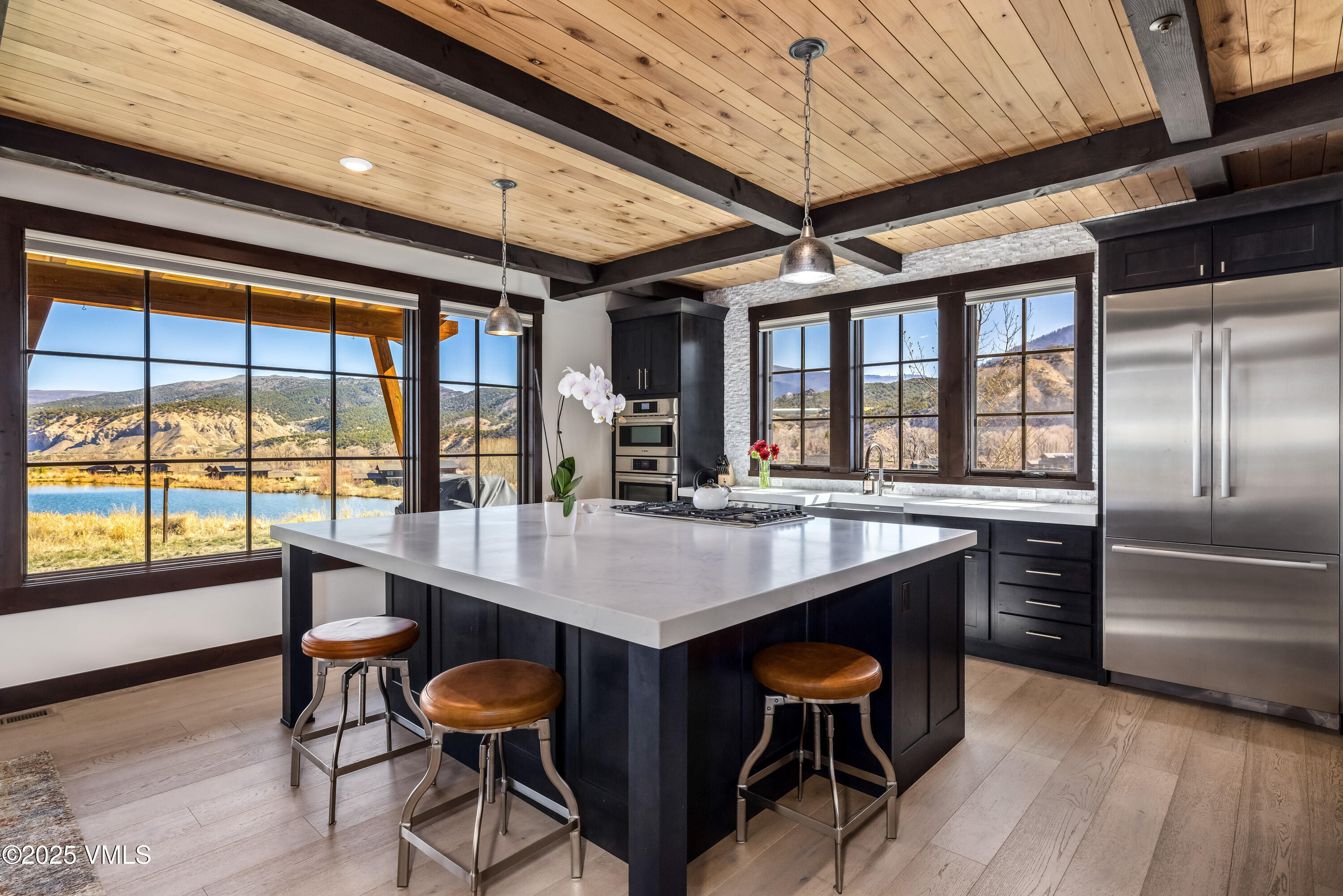 140 Hunters View Lane Eagle, CO 81631 - Photo 12 of 38 a dining table with chairs and wooden floor