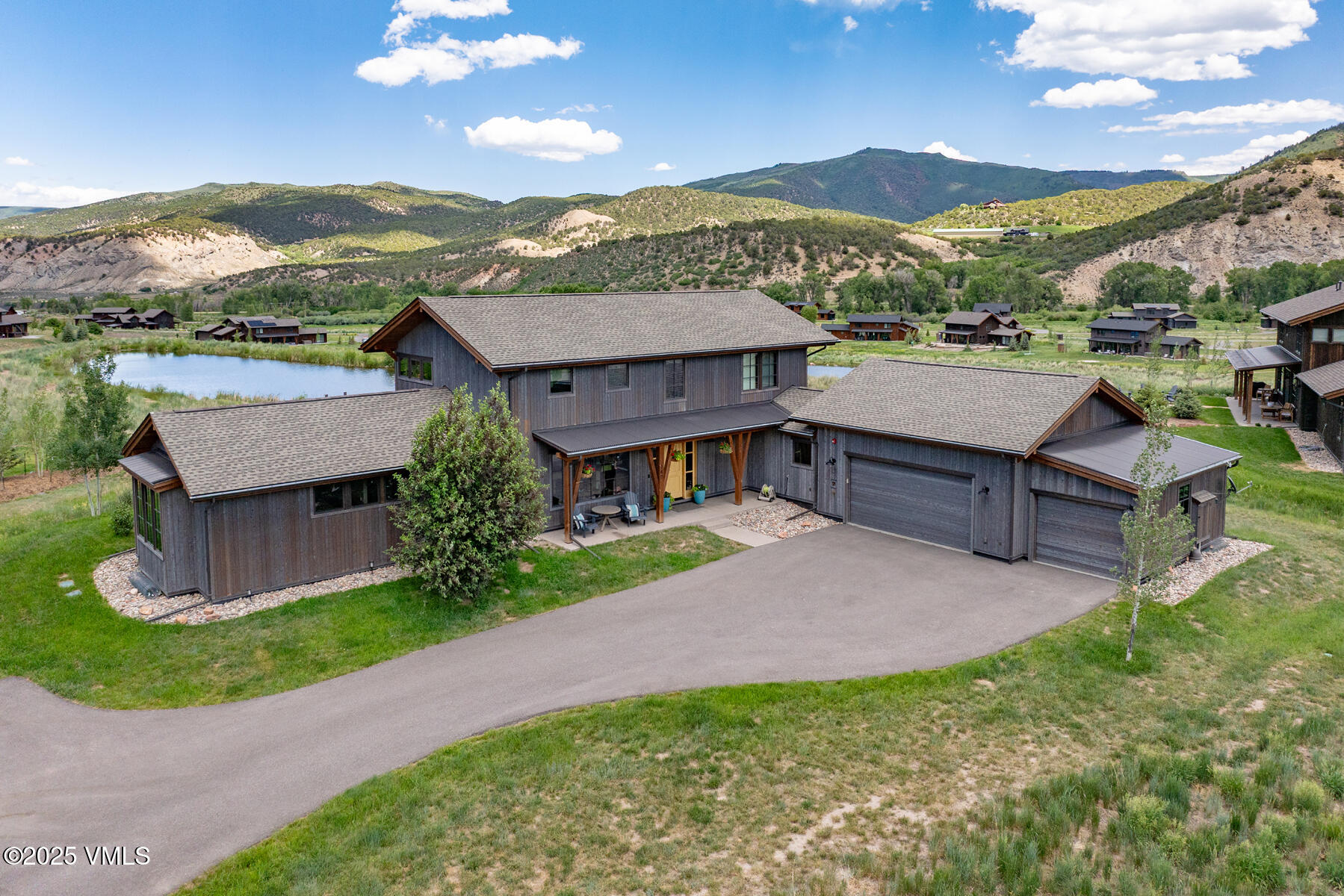 140 Hunters View Lane Eagle, CO 81631 - Photo 2 of 38 a view of a house with a yard and a garden