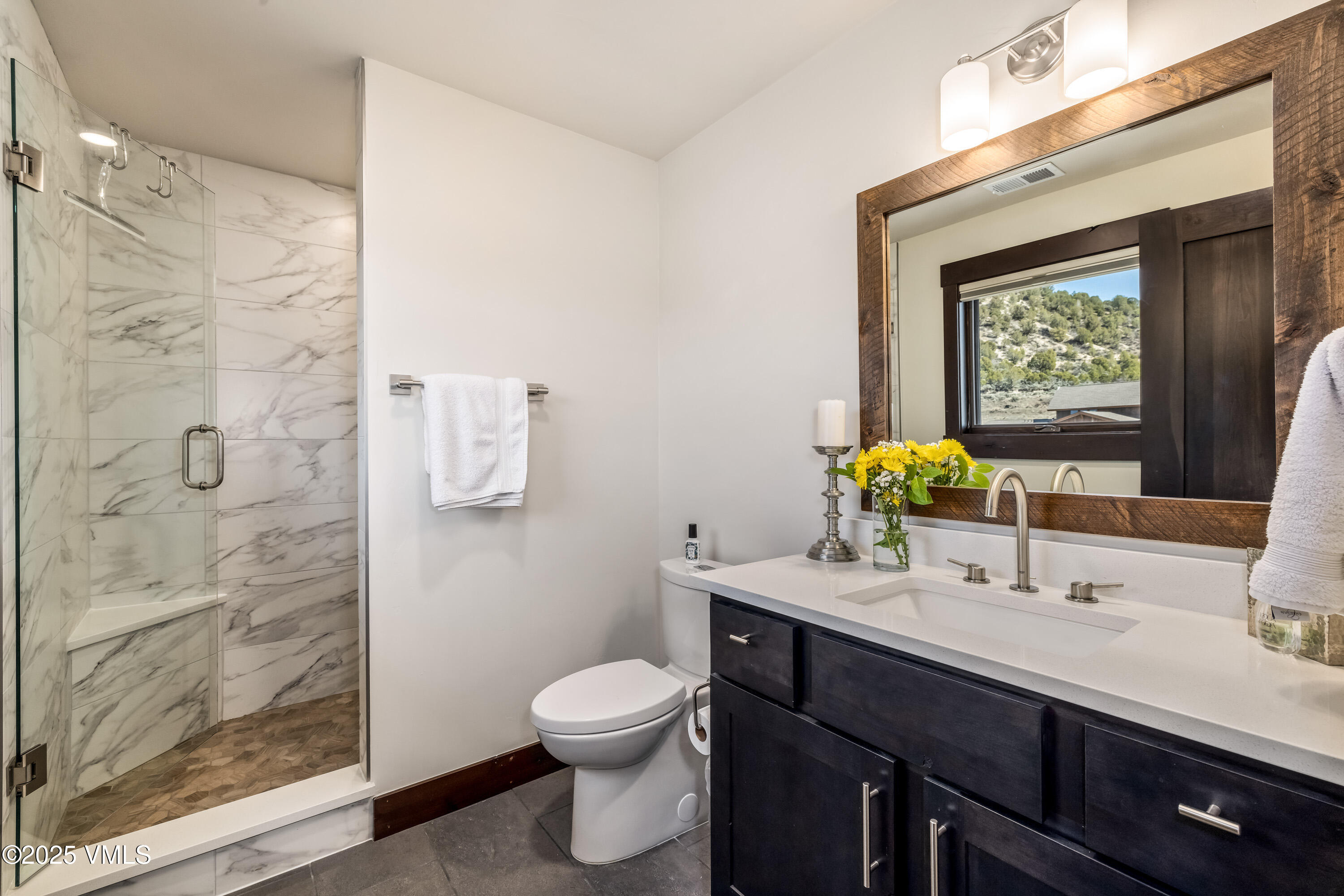 140 Hunters View Lane Eagle, CO 81631 - Photo 21 of 38 a bathroom with a sink a toilet and shower