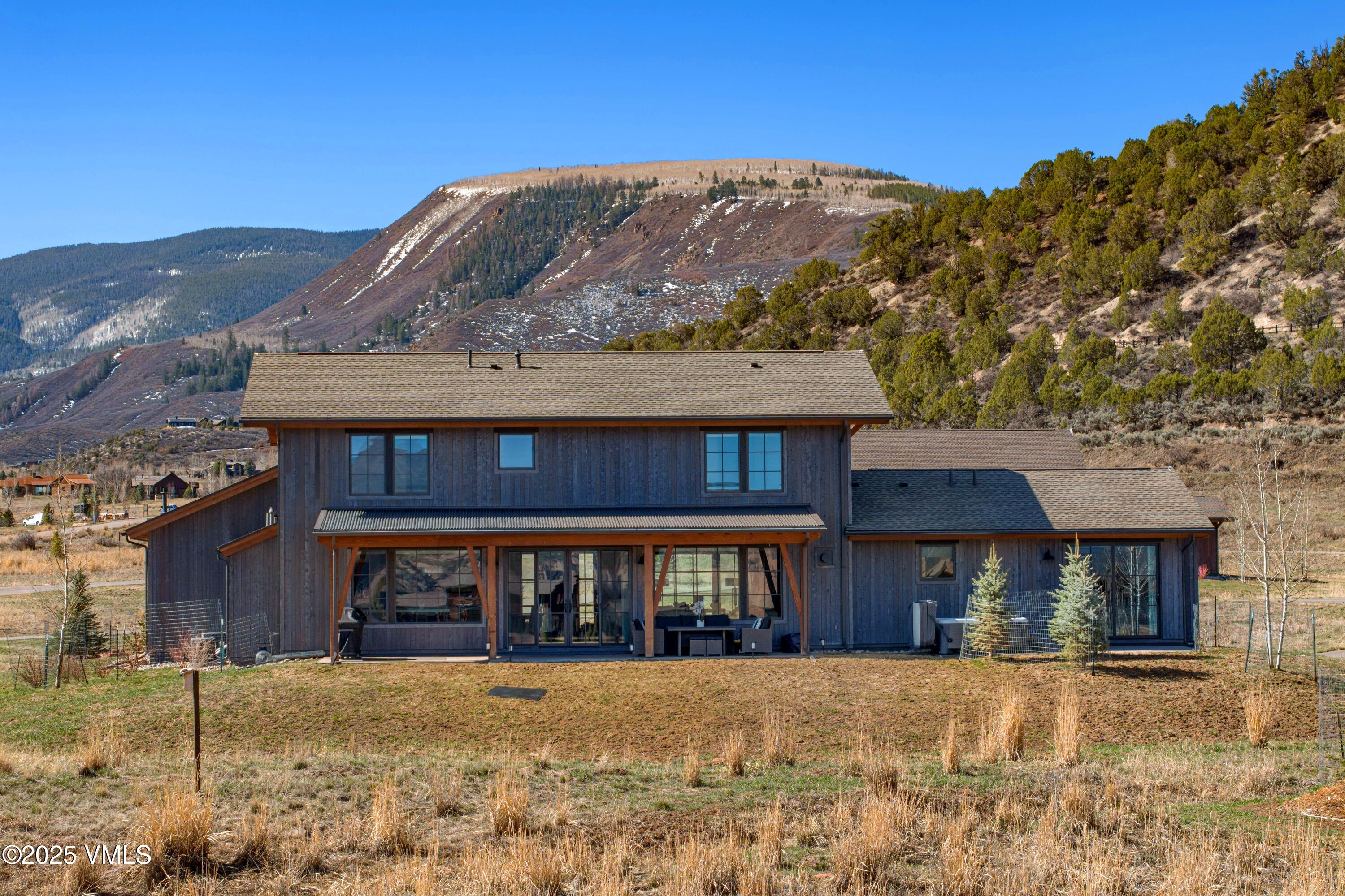 140 Hunters View Lane Eagle, CO 81631 - Photo 30 of 38 a front view of a house with a yard