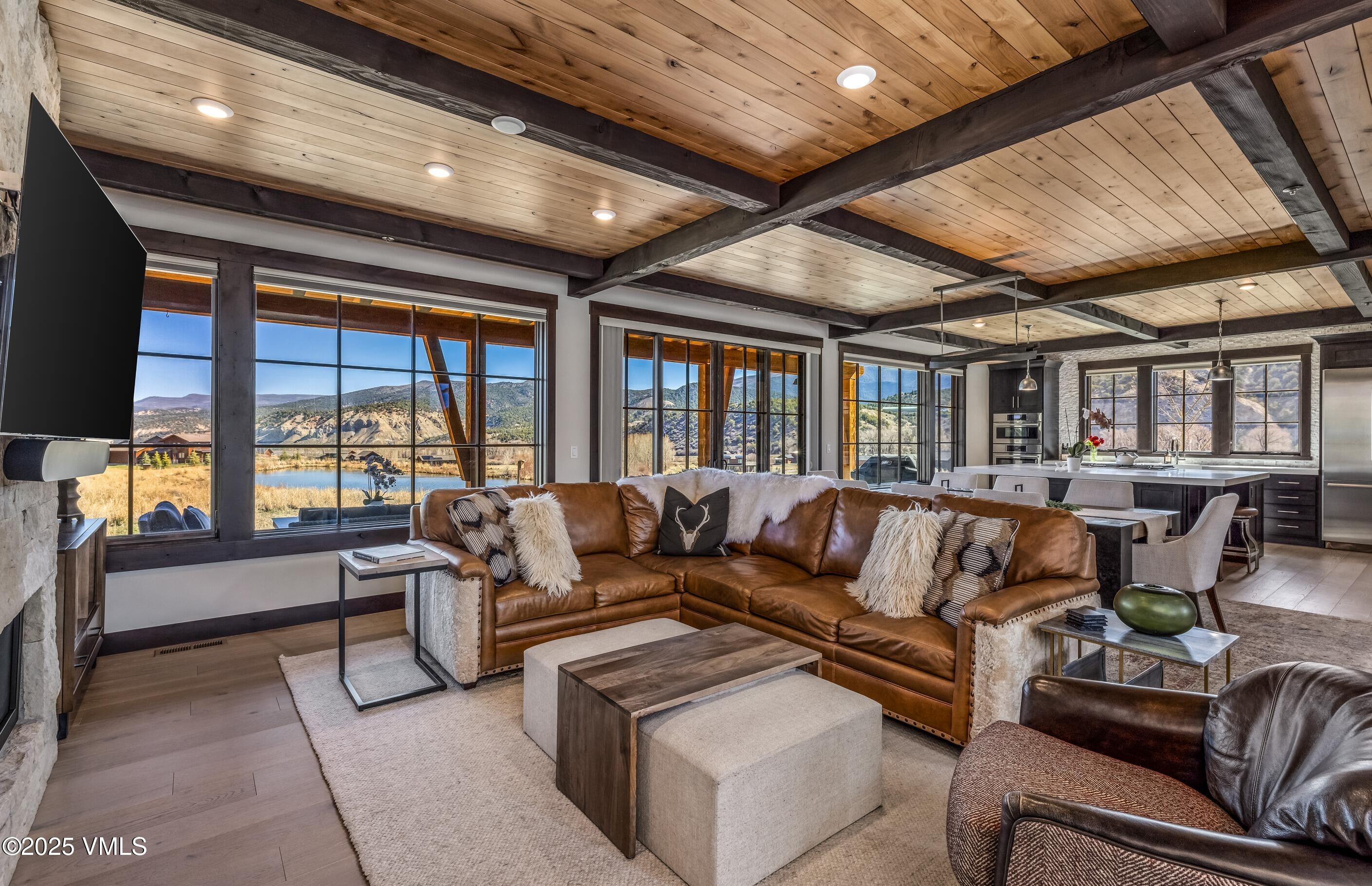 140 Hunters View Lane Eagle, CO 81631 - Photo 5 of 38 a living room with furniture and a large window
