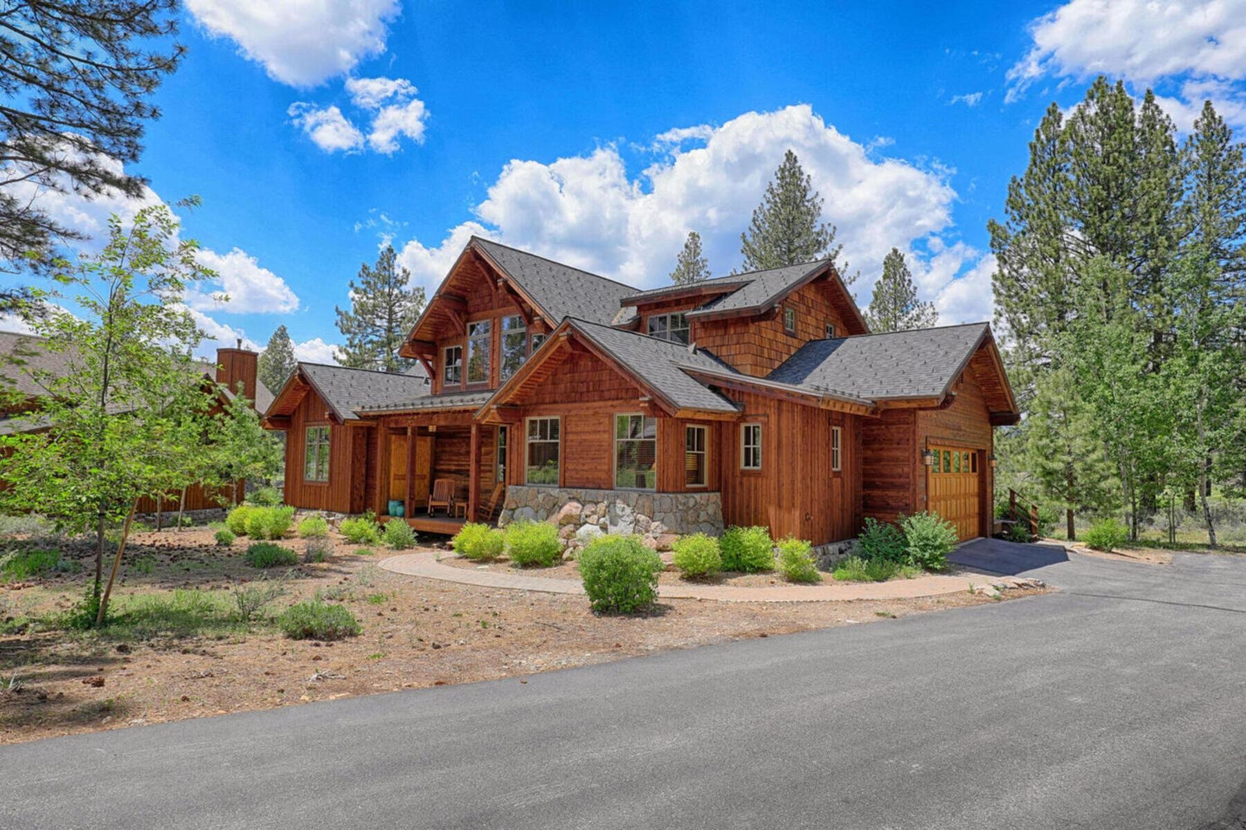 12202 Lookout Loop, Unit F2009 Truckee, CA 96161 - Photo 4 of 28 a front view of a house with a yard and a garage