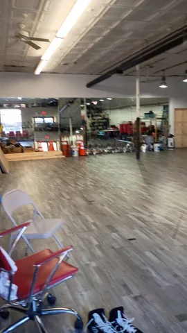 a view of a studio with wooden floor