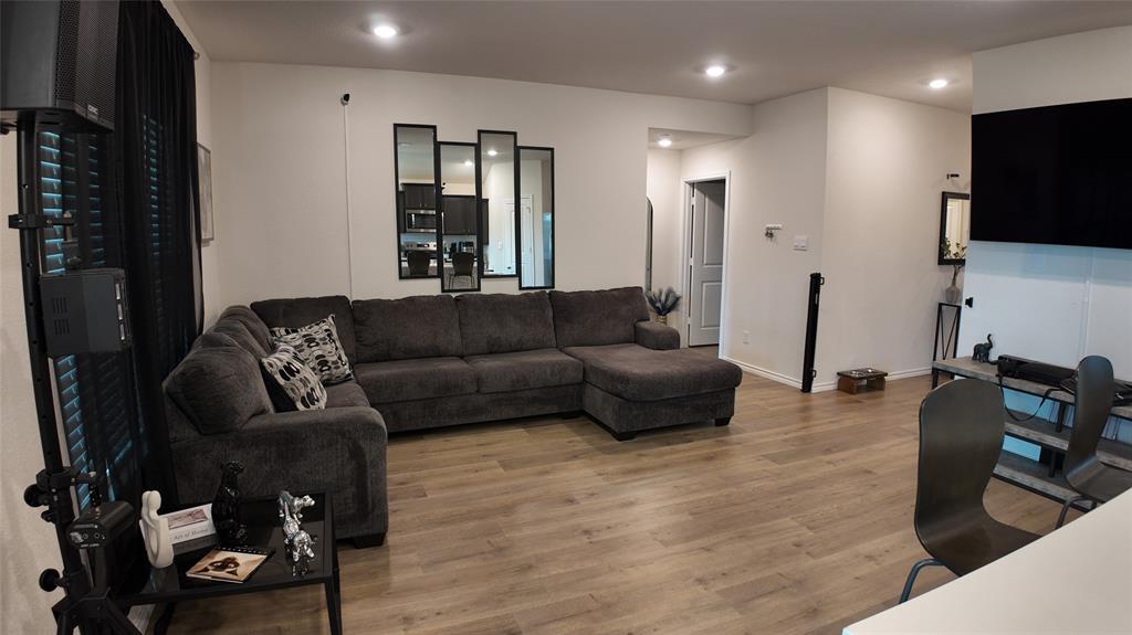 1215 Rustic Vw Lane Denton, TX 76207 - Photo 6 of 25 a living room with furniture and a flat screen tv