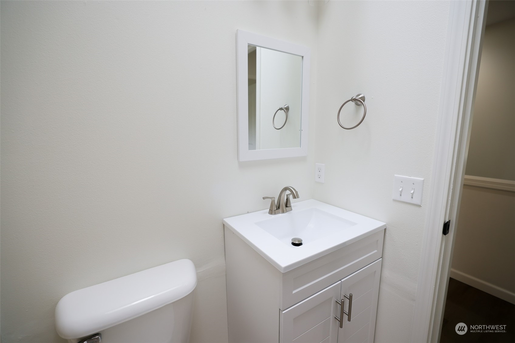 24833 Florence Acres Road Monroe, WA 98272 - Photo 13 of 21 a bathroom with a toilet sink vanity and mirror