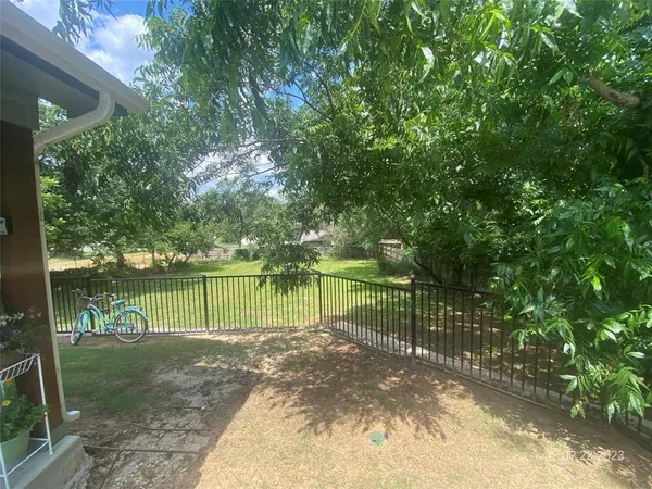 an aerial view of a house with yard and outdoor seating