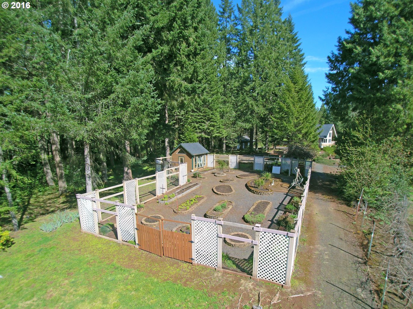 39586 Little Fall Creek Road Lowell, OR 97452 - Photo 23 of 30 a view of a patio with a table and chairs