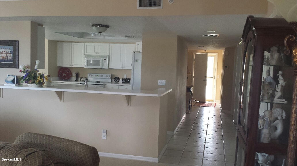 104 Riverside Drive, Unit 306 Cocoa, FL 32922 - Photo 13 of 27 View into kitchen