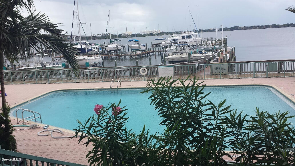 104 Riverside Drive, Unit 306 Cocoa, FL 32922 - Photo 22 of 27 Pool and view of the Indian River