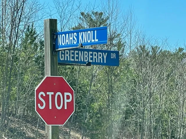 a sign broad on the side of the road