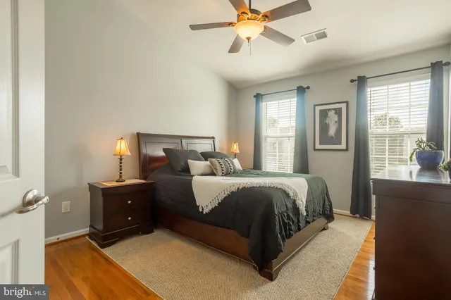 a view of a patio with chairs and a small yard